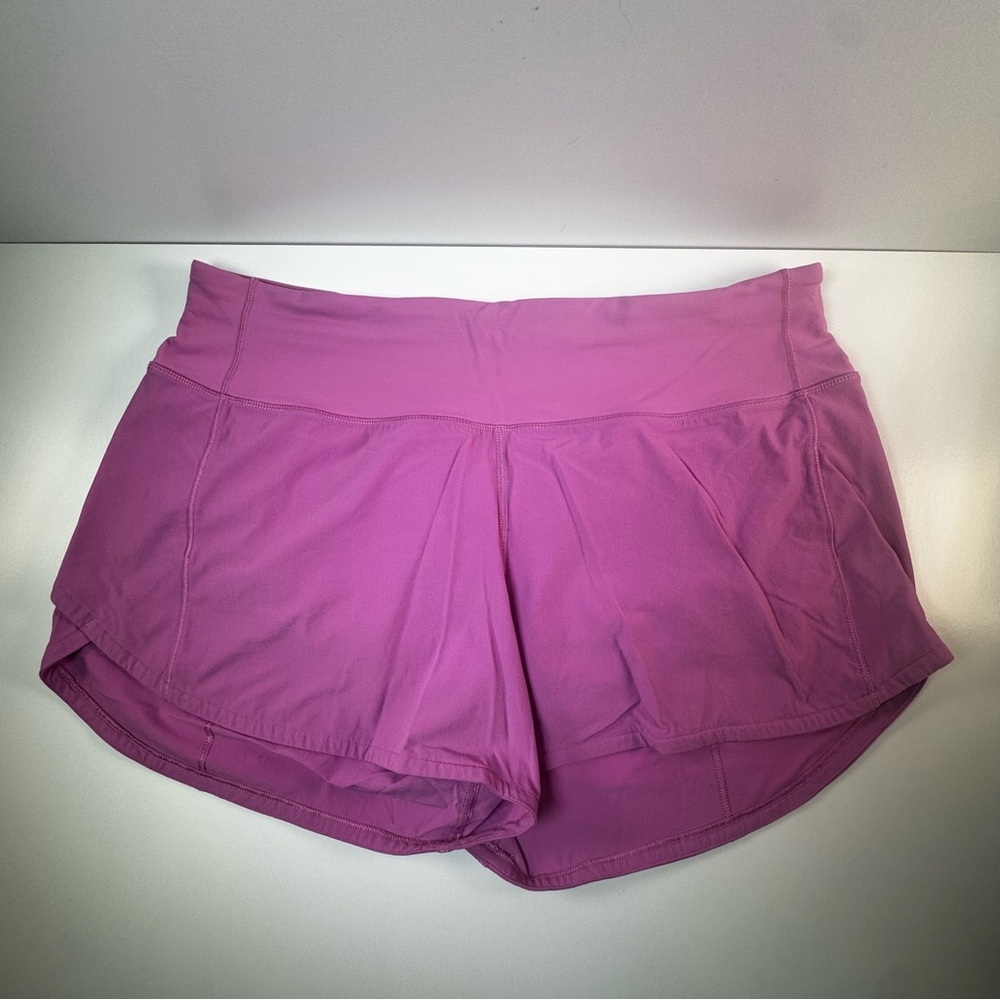 Speed Up Mid-Rise Lined Short 4"
Color: Magenta Glow. Size 8 Tall